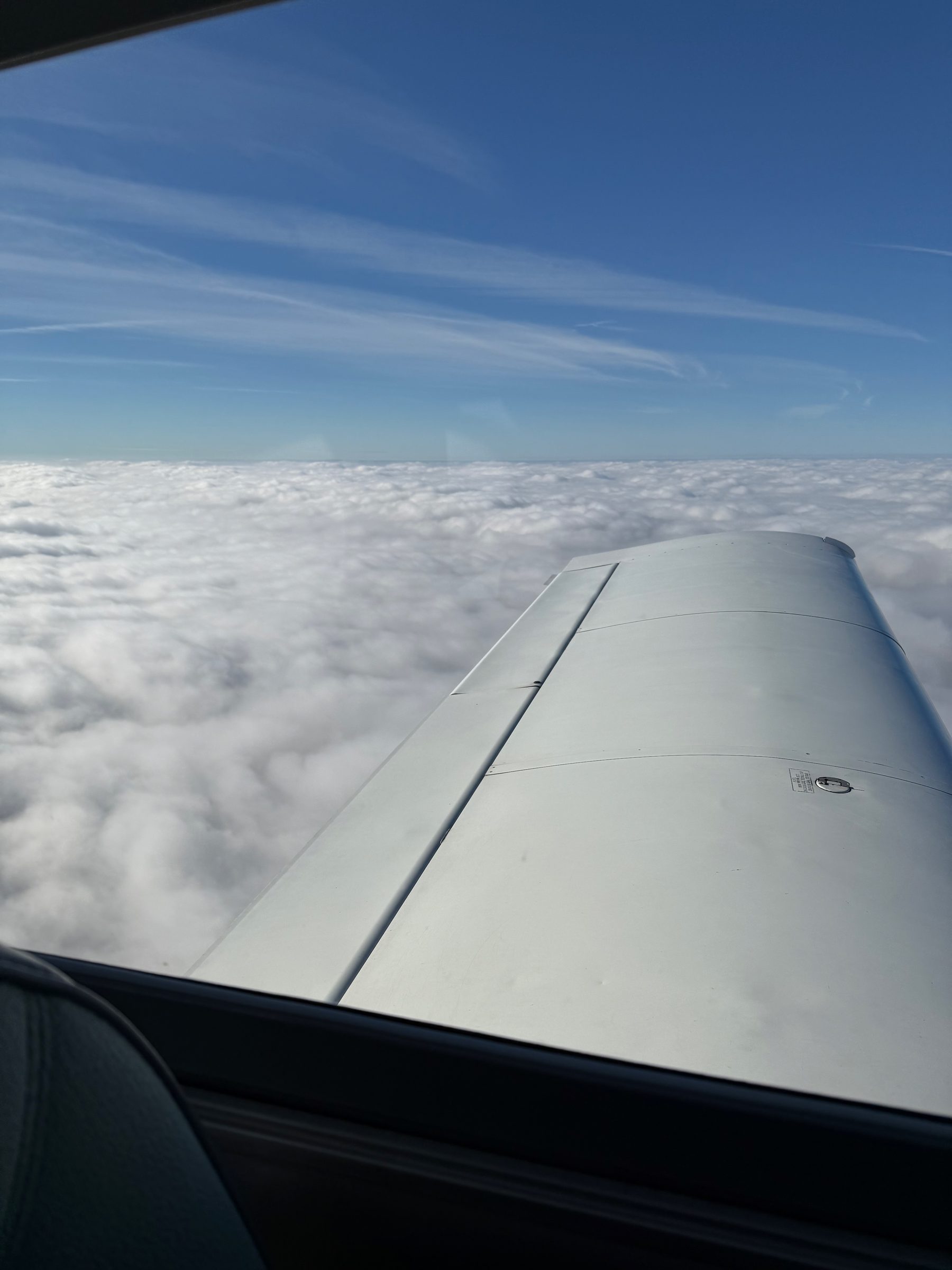View from N26248's wing above the clouds
